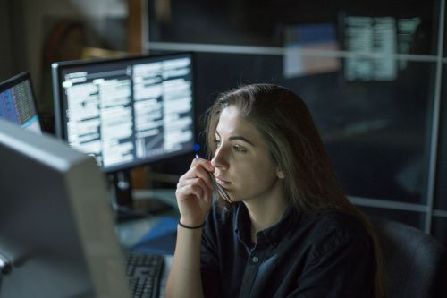 Crime analyst at her workstation looking at crime statistics